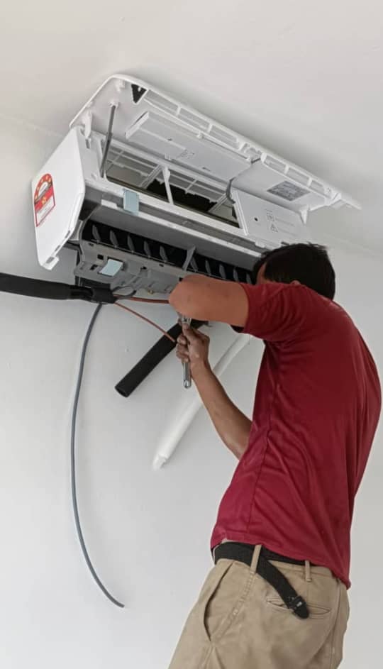 KL Renovator technician performing professional aircond installation Kuala Lumpur
